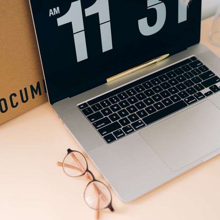 Modern workspace with clock showing time management principles in action