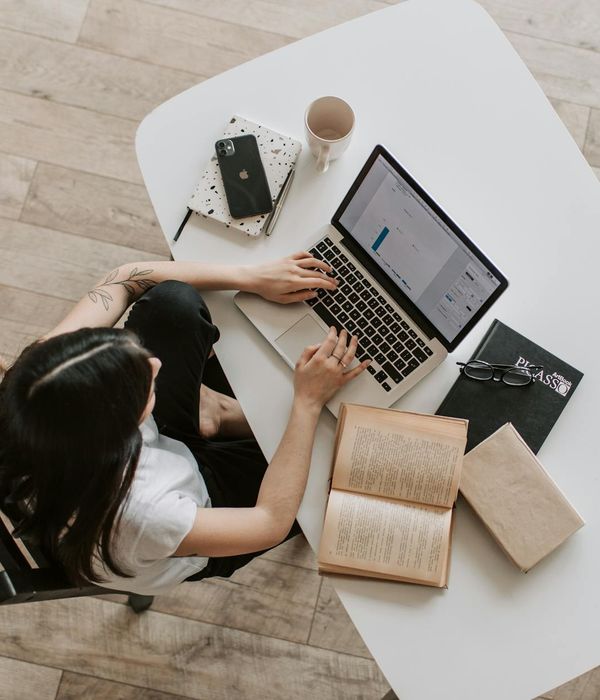 Productive workspace with open books and laptop for focused learning