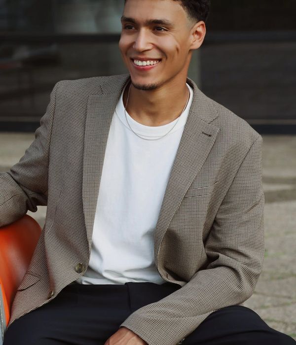 Young professional man in modern casual clothing with friendly expression